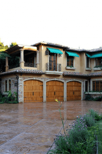 tuscan style design home view of house garage