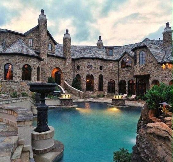 stone mansion and pool